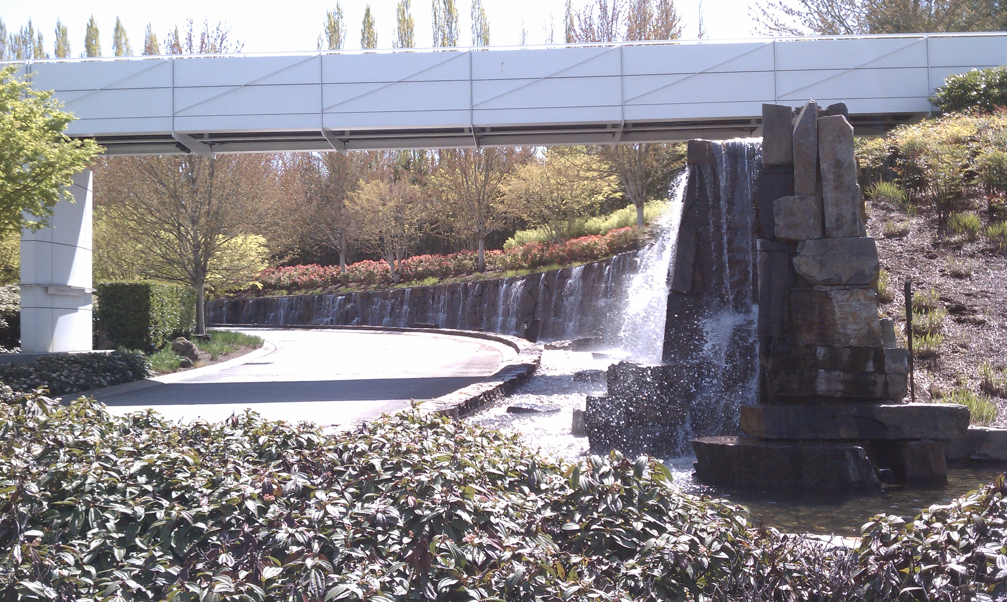 Natural Stone Rock Waterfall and Bridge at Campus Entrance